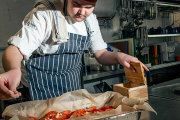 A student preparing food in The Wharncliffe kitchen