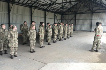 Protective Services students lined up wearing army uniforms