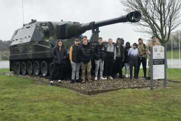 Protective Services students stood by a tank