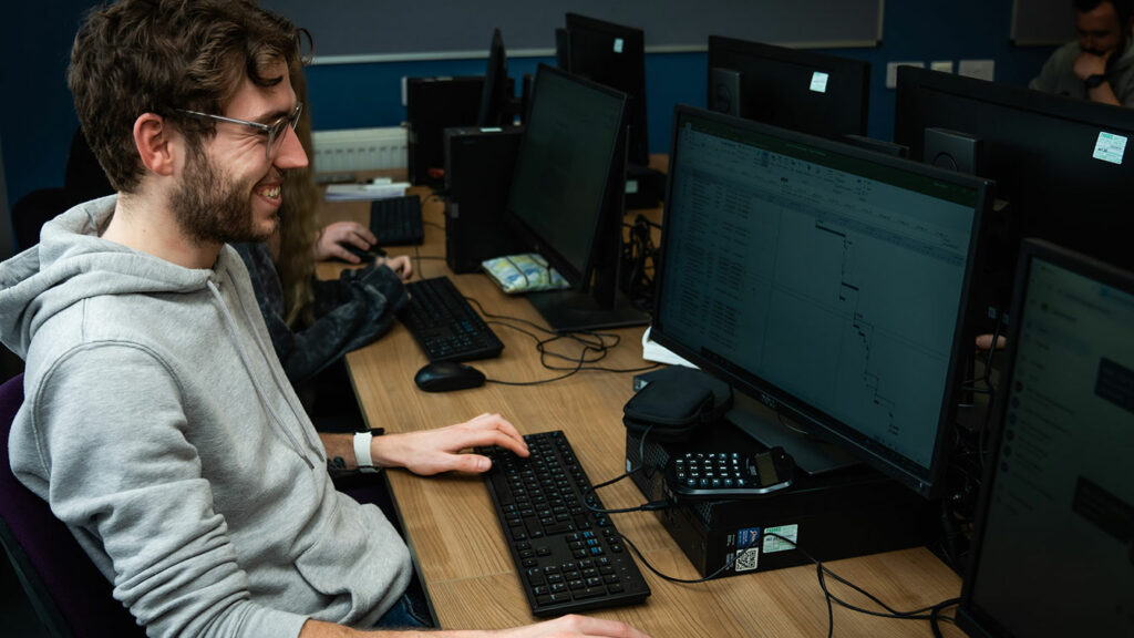 A student sat at a computer