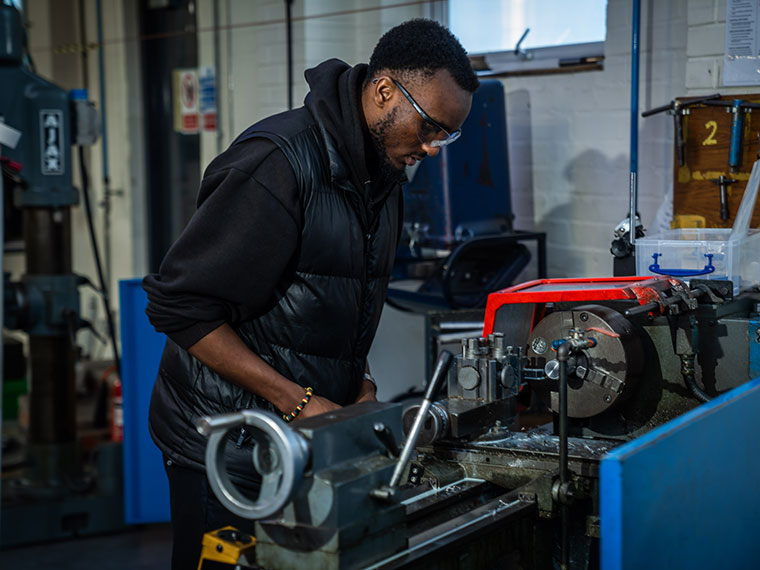 An engineering student working in the workshop