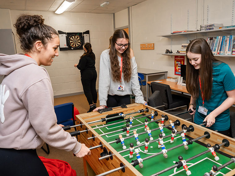 Students playing table football