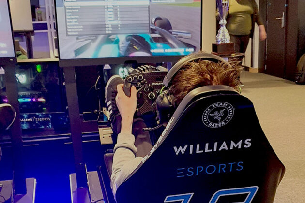 An esports student playing a game