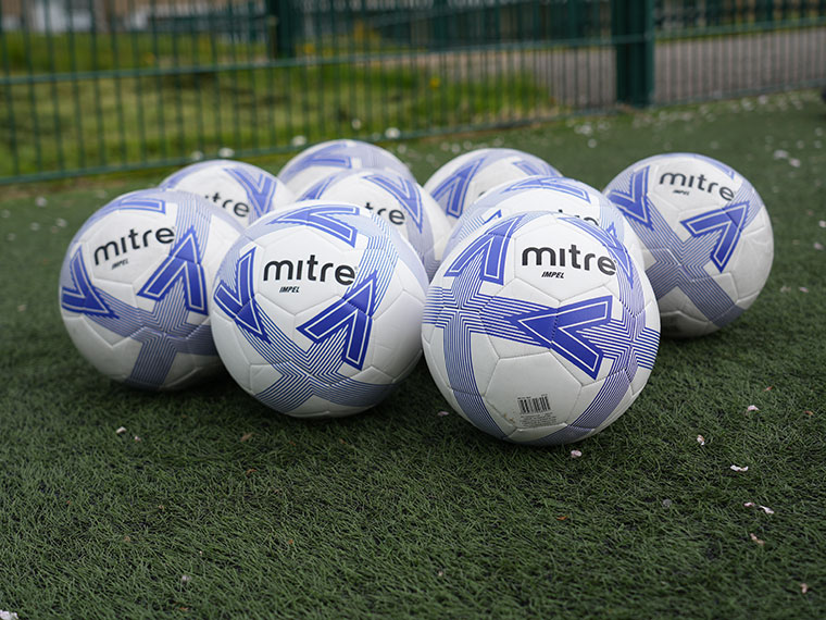 Footballs on a football pitch