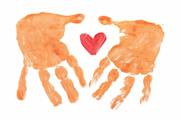 Hand print paints with a heart shape