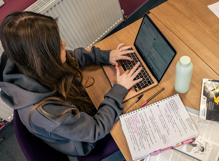 A student studying at a desk