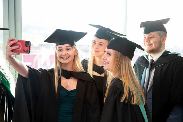 Students taking a selfie after the graduation 2023 ceremony