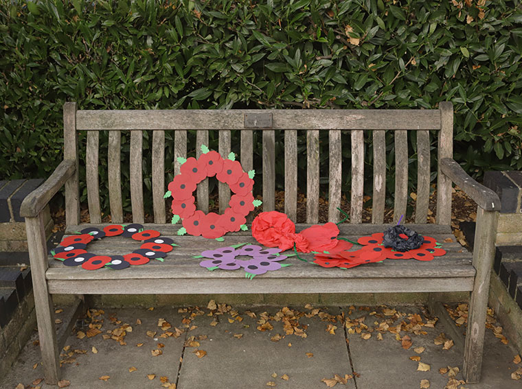 A bench with poppies on