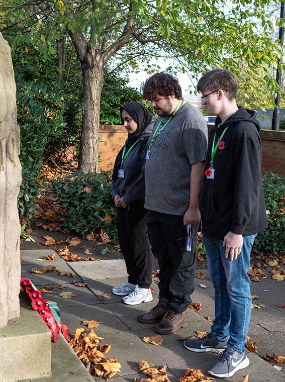 Students paying their respects at a war memorial